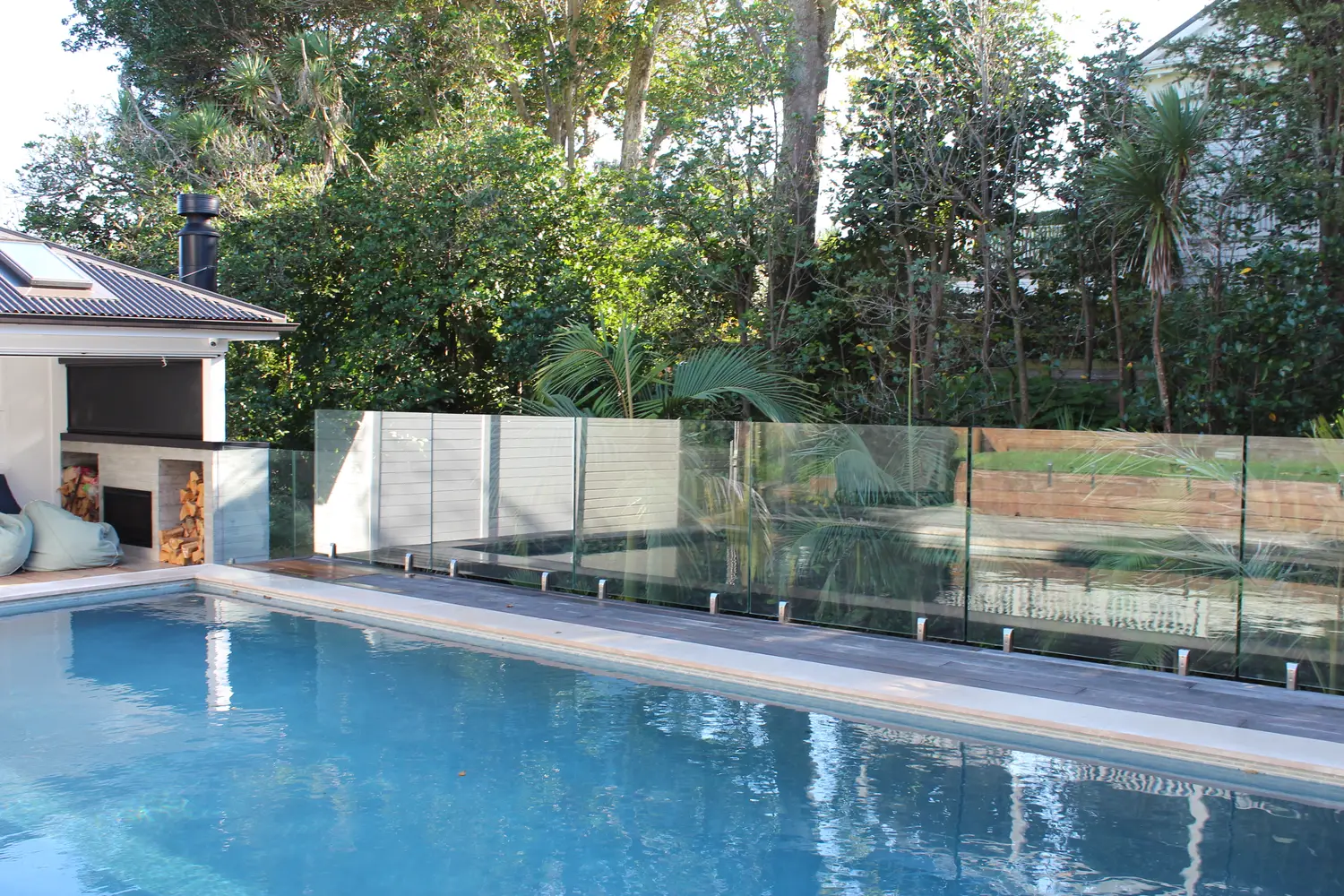 Frameless glass pool fence around a swimming pool at Calliope Road, Devonport