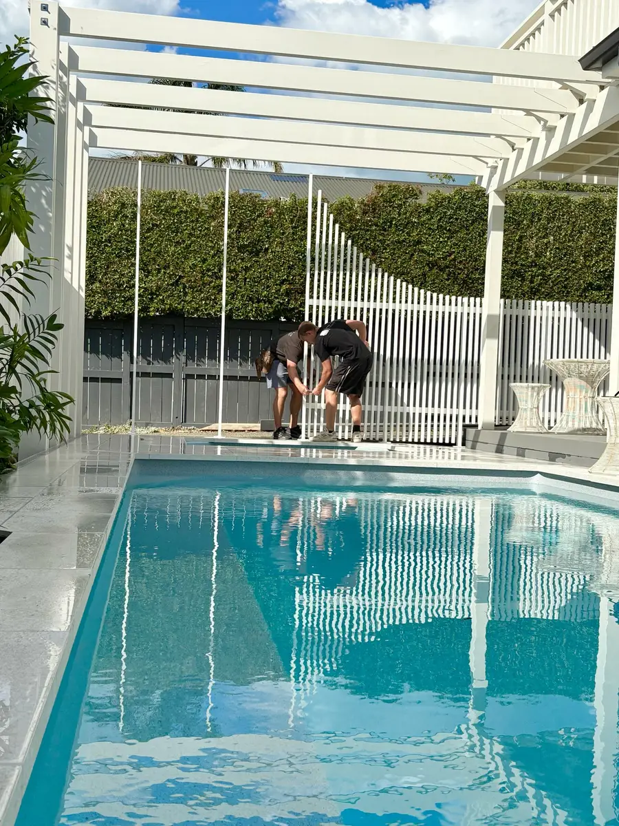 The team installing the aluminium pool barrier